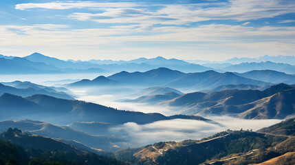 Fototapeta na wymiar Misty morning with a range of mountain with blue cloudy sky