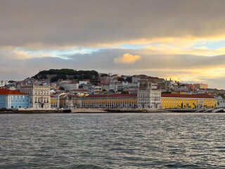 Fototapeta na wymiar Lisbon Comercio Square and Saint George Castle hill seen from the Tagus River