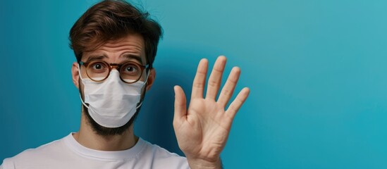 Portrait of Caucasian man showing vaccinated hand on blue studio background, flyer with copyspace for ad, representing emotions, vaccination, healthcare, and COVID prevention. - obrazy, fototapety, plakaty