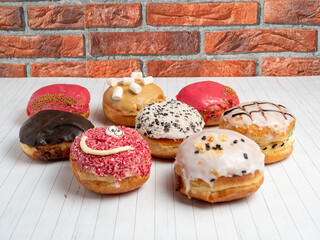 Sweet donut on a wooden background. Sweet bun close-up.