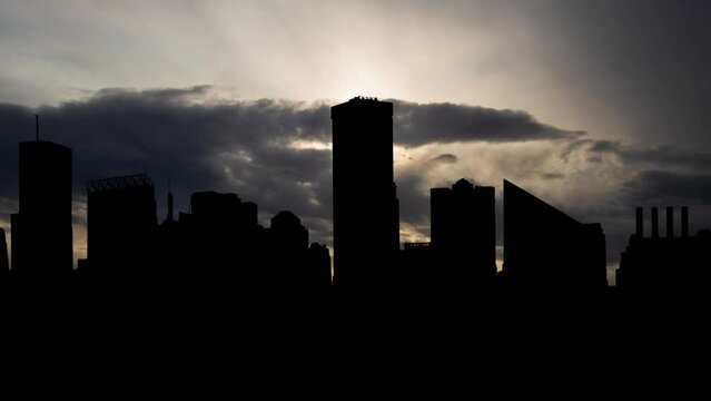 Downtown Baltimore city skyline at Sunrise ,Time Lapse with Fast Clouds and Dark Silhouette of Skyscrapers
