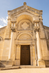 Fototapeta na wymiar entrance to Collégiale Saint Martin et Tour Charlemagne Tours, Basilica religious building outside on sunny summer day 