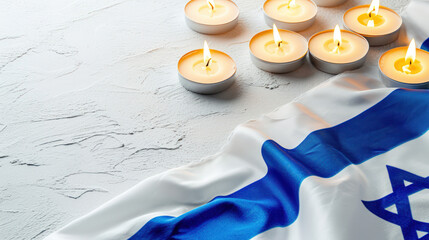 Burning candles on the background of the Israeli flag.