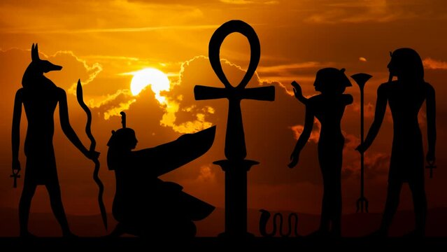 Egyptian hieroglyphs with cross Ankh or Key of life symbol, Time Lapse at Sunset with Red Sun and Fiery Sky