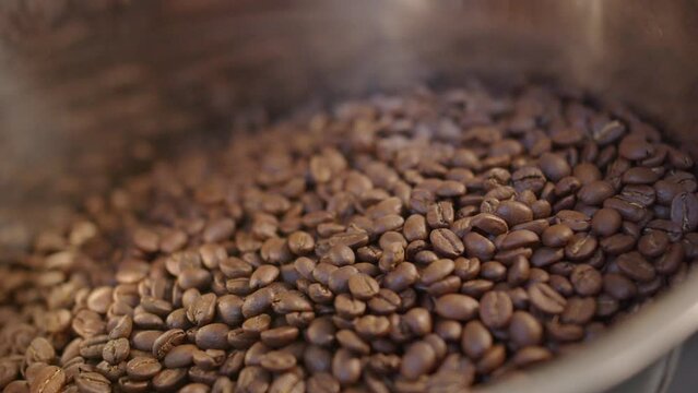Close up of mixing coffee seeds. Fragrant and roasted coffee beans, hot aroma coffee and organic freshness, roast coffee