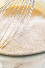 Lemon poppy seed muffins garnished with almond slivers