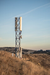 Cell 5G tower in mountains, cellular base station with mobile antenna transmits signals, extension...