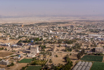 The aerial view on downtown of the Palestinian city of Jericho, West Bank, Palestine, during the hot summer day.