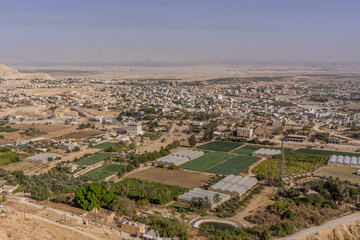 Fototapeta premium The aerial view on the farms, and residential houses at Jericho, West Bank, Palestine, during the hot summer day.
