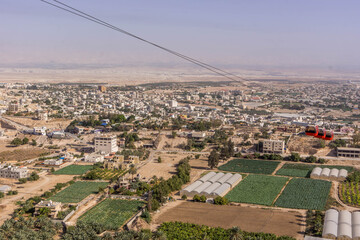 The aerial view on the farms, and residential houses at Jericho, West Bank, Palestine, during the hot summer day.