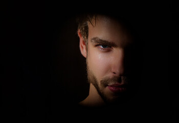 Shadow gangster portrait. Gangster crime young guy. Crime gang members. Crimes style. Man burglar. Angry man. Man with strong body on black in studio. Close up face of brutal gangster.