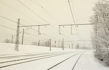 Winter railway landscape, Railway tracks in the snow-covered industrial country