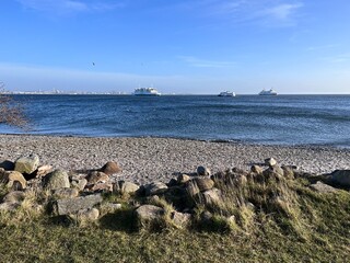 sea coast and ships on the horizon © Adam