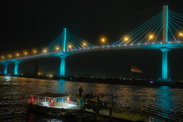 intentional camera movement photo of lights on bridge at night