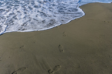 footprints of a woman on the beach of the Mediterranean Sea 1