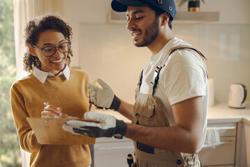 Male plumber or repairman close deal with female client after work or fix at home