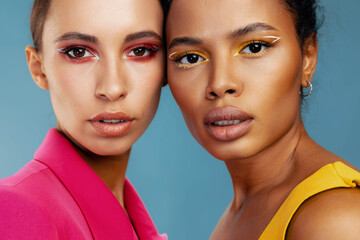 Woman skin beauty together happy beautiful two make-up model race colorful studio mixed