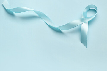 Satin ribbon on light blue background. Prostate cancer concept