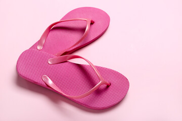 Flip-flops on pink background, closeup