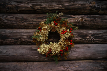 Dry flower wreath on a wooden surface. Backaground.