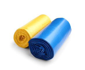 Blue and yellow rolls of garbage bags isolated on white background