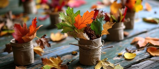 Naklejka na ściany i meble Kids can create a foliage-filled vase using recycled materials for an autumn-themed craft.