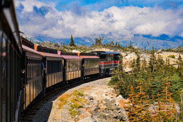 Fototapeta na wymiar Narrow-gauge train of the White Pass and Yukon Route in the Alaskan mountains between Skagway and Canada