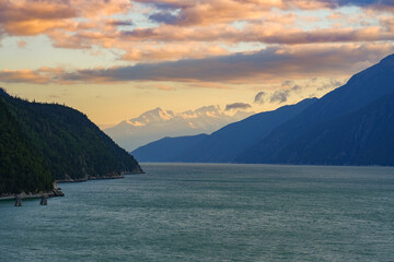Sunset over the waters of the Taiya Inlet in the Pacific Ocean near Skagway, Alaska