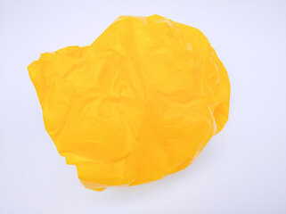 Yellow plastic bag isolated on white background