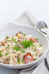 Homemade South Carolina chicken bog dish with smocked sausages, in bowl, vertical, copy space