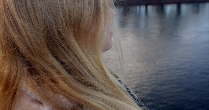 Meditation and self-awareness wind and water can create a calming atmosphere, and the girl may use this moment for meditation, self-reflection, or seeking inner peace.