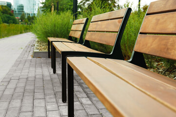 Wooden benches in park, closeup