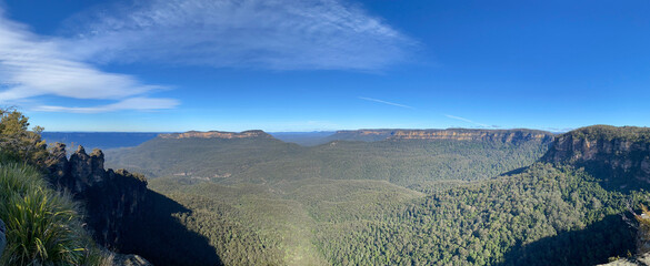 Spectacular panoramical views from a mountain-top lookout. Three sisters rocks at the Blue mountains, Australia, NSW. Unusual rock formation. Summit of the mountain.