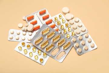 Heap of different pills on color background