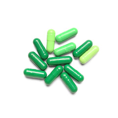 Green capsules isolated on white background