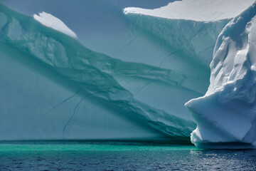 Beautiful blue icebergs in the North Atlantic Ocean off the entrance to Twillingate harbor in...