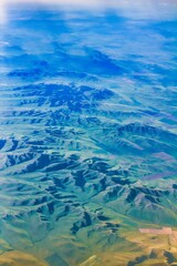 Beijing, China - July 20 2010 : a mysterious looking mountain range seen from an air plane