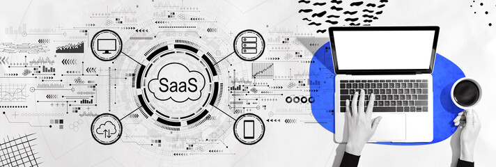 SaaS - software as a service concept with person using a laptop computer - obrazy, fototapety, plakaty