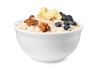 Tasty boiled oatmeal with blueberries, banana and nuts in bowl isolated on white