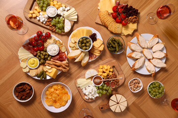 Assorted appetizers served on wooden table, flat lay