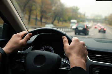 Man driving his car, closeup. Traffic rules