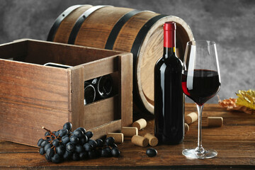 Winemaking. Composition with tasty wine and barrel on wooden table