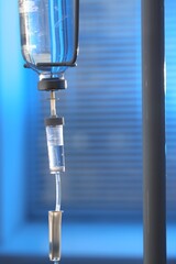 IV drip against blurred background. Intravenous therapy