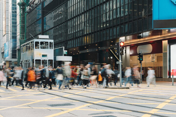 Busy city street people on zebra crossing at Hong Kong