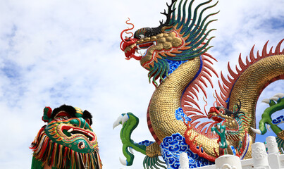 Dragon and lion  dance against with Dragon Status, Chinese Culture