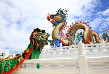 Dragon and lion  dance against with Dragon Status, Chinese Culture