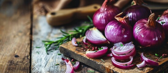 An onion on a cutting board with space for text. - obrazy, fototapety, plakaty