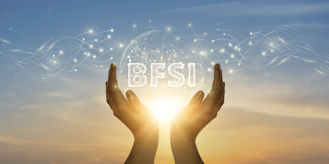 BFSI: Man Holding Global Network and Connecting Data of Banking, Financial Services, and Insurance...