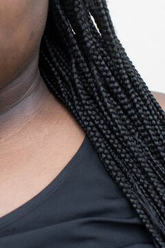 Brown skin woman with box braids, long box braids on brown skin
