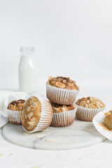 almond muffins on a white marble tray, homemade bakery style almond muffins on a white background